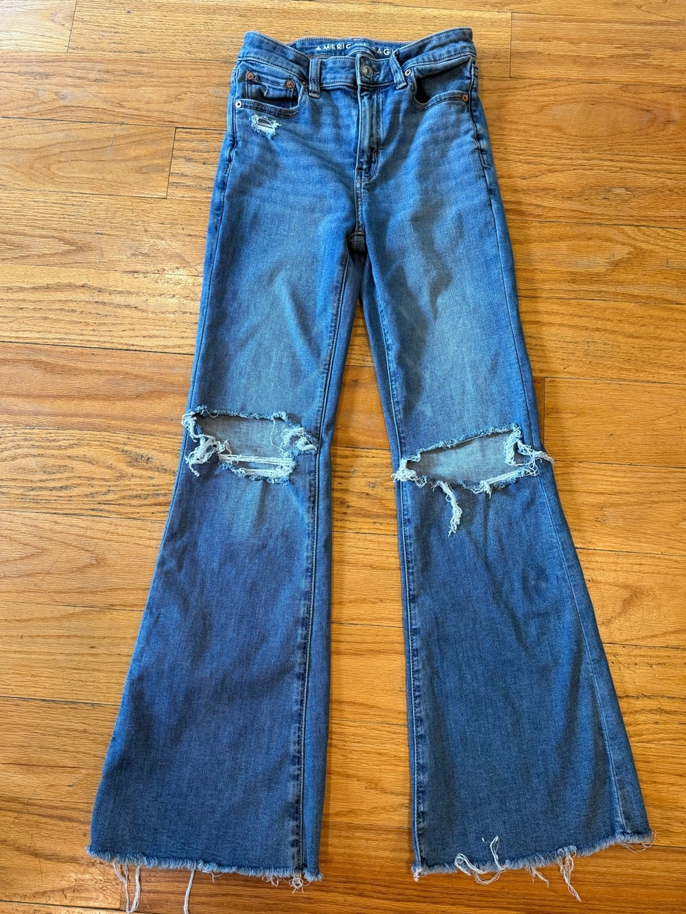 American Eagle Outfitters Medium Blue Flare Jeans with Knee Rips
